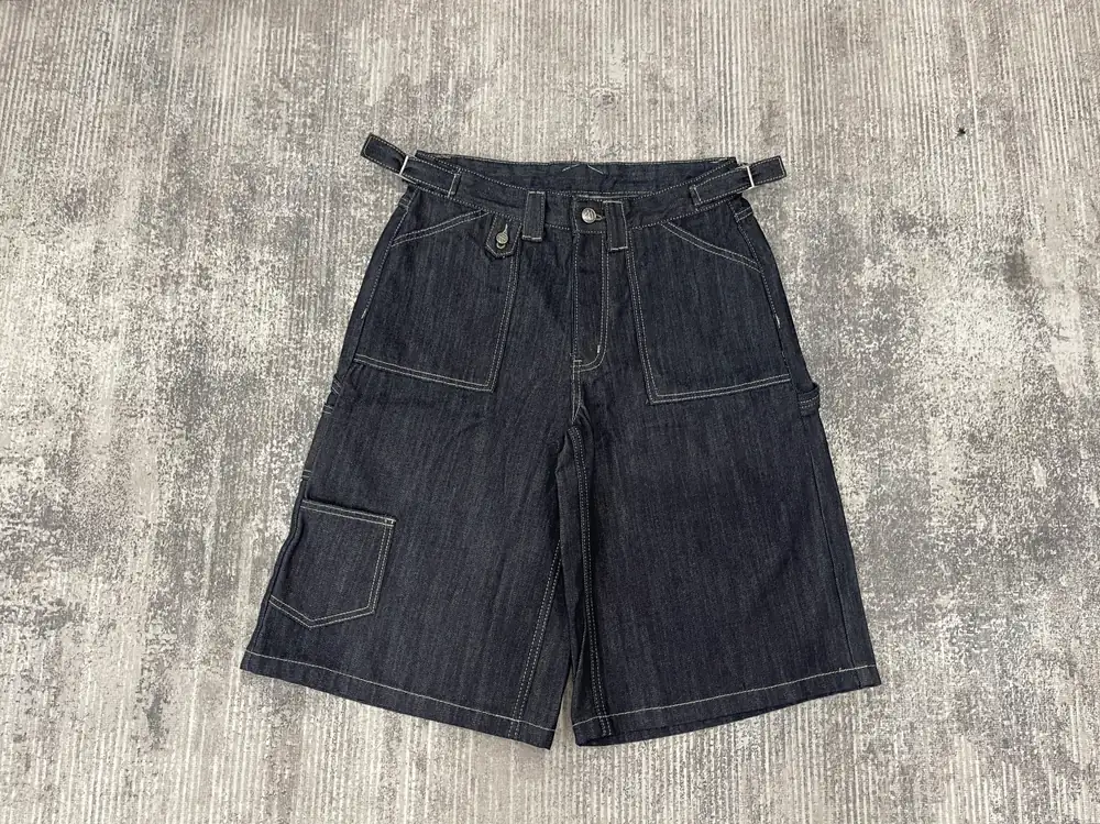 Dark denim utility shorts with large front pockets and side adjusters
