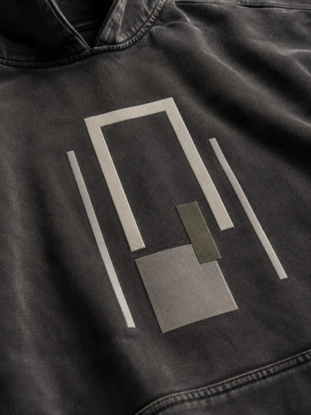 Close-up of a structured geometric high-density print on dark jersey