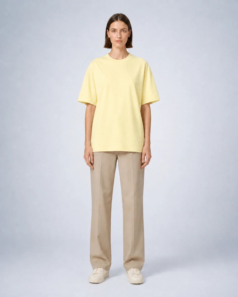 Driov Inspire Tee shown in a full-length front model view in Light Yellow