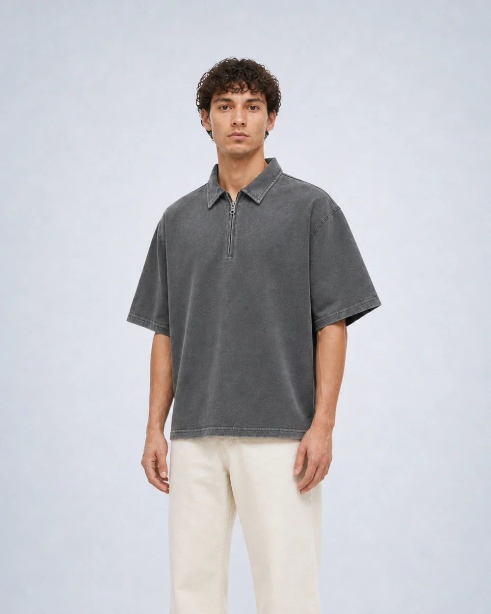 Ridge Half-Zip shown in a mid-length three-quarter model view in Waxed Grey