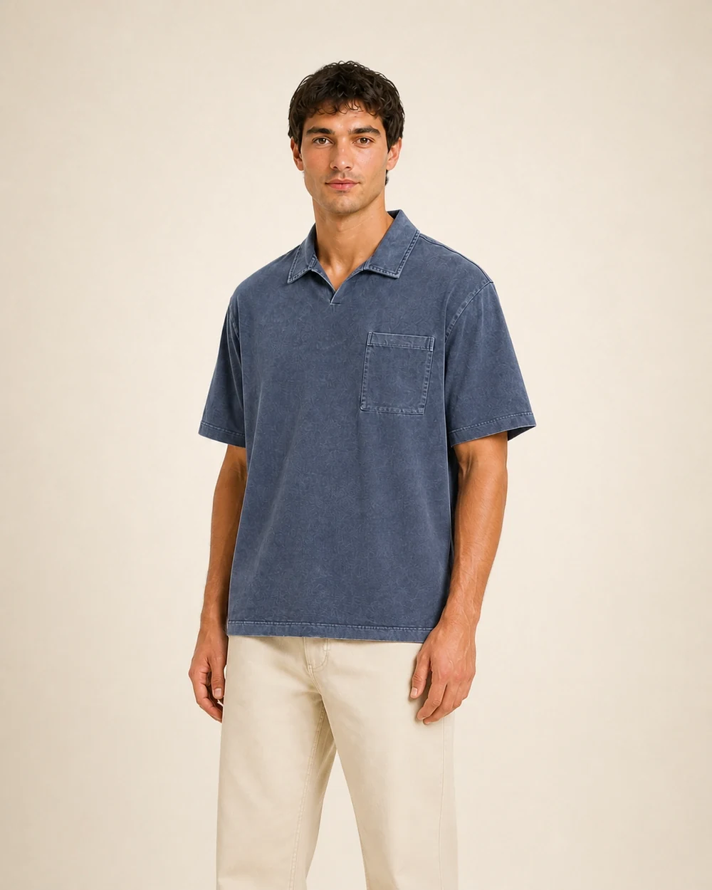 Foundry Polo shown in a mid-length three-quarter model view in Washed Blue Grey