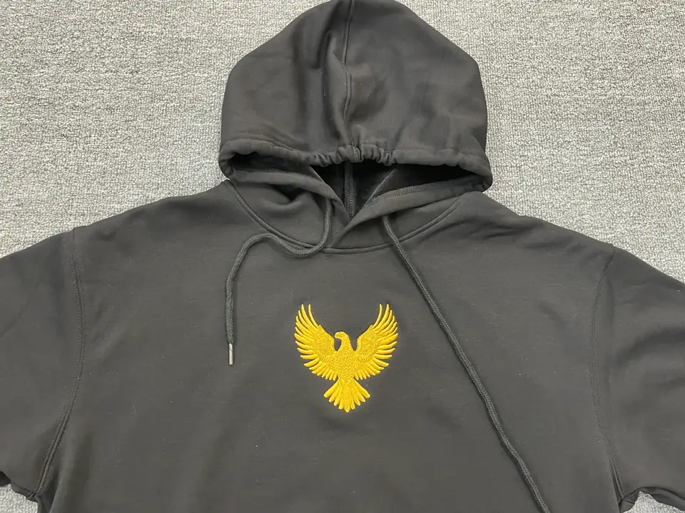 Apparel embroidery machine producing a stitched design