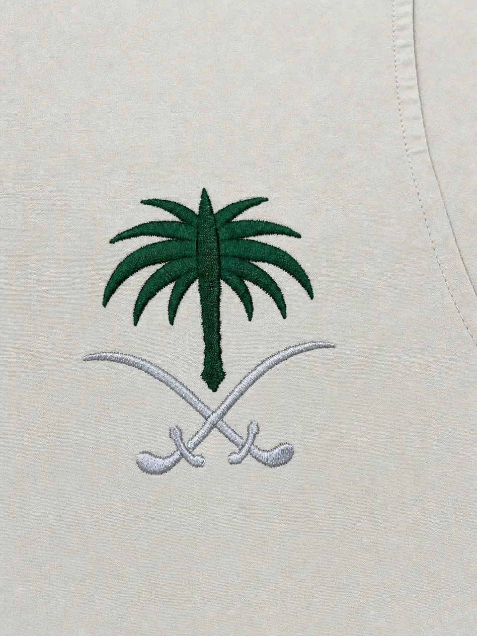 Finished embroidered logo displayed on a garment