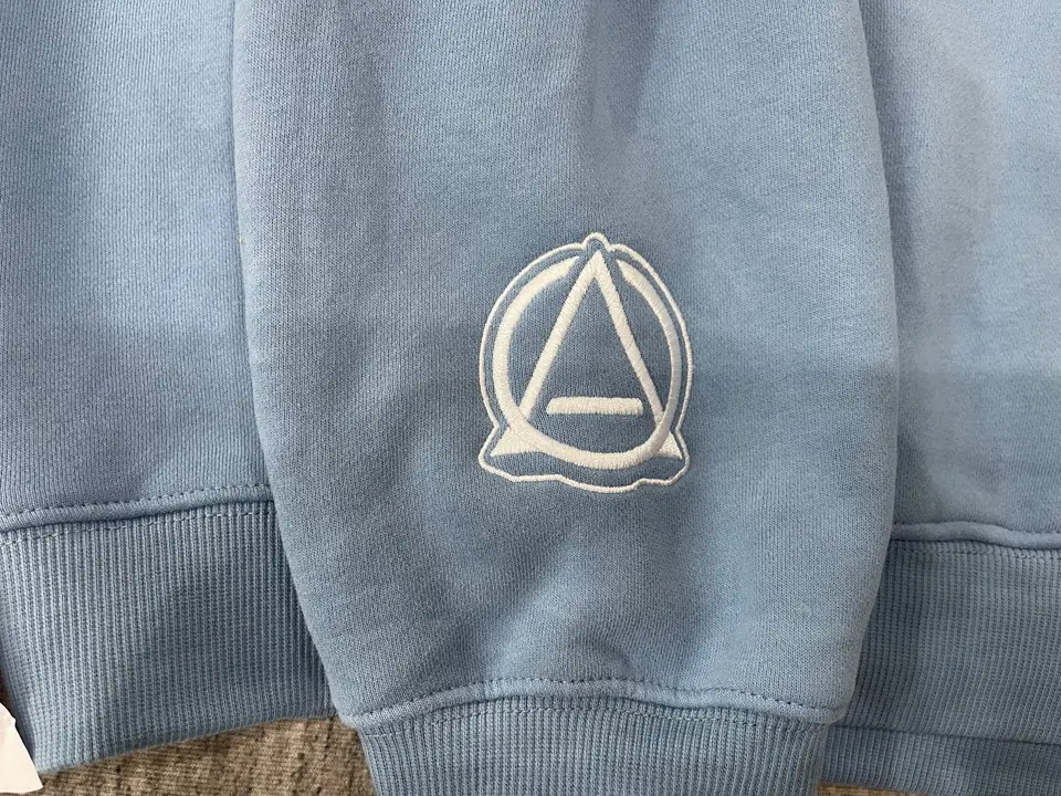 Finished embroidery result inspected on the garment surface