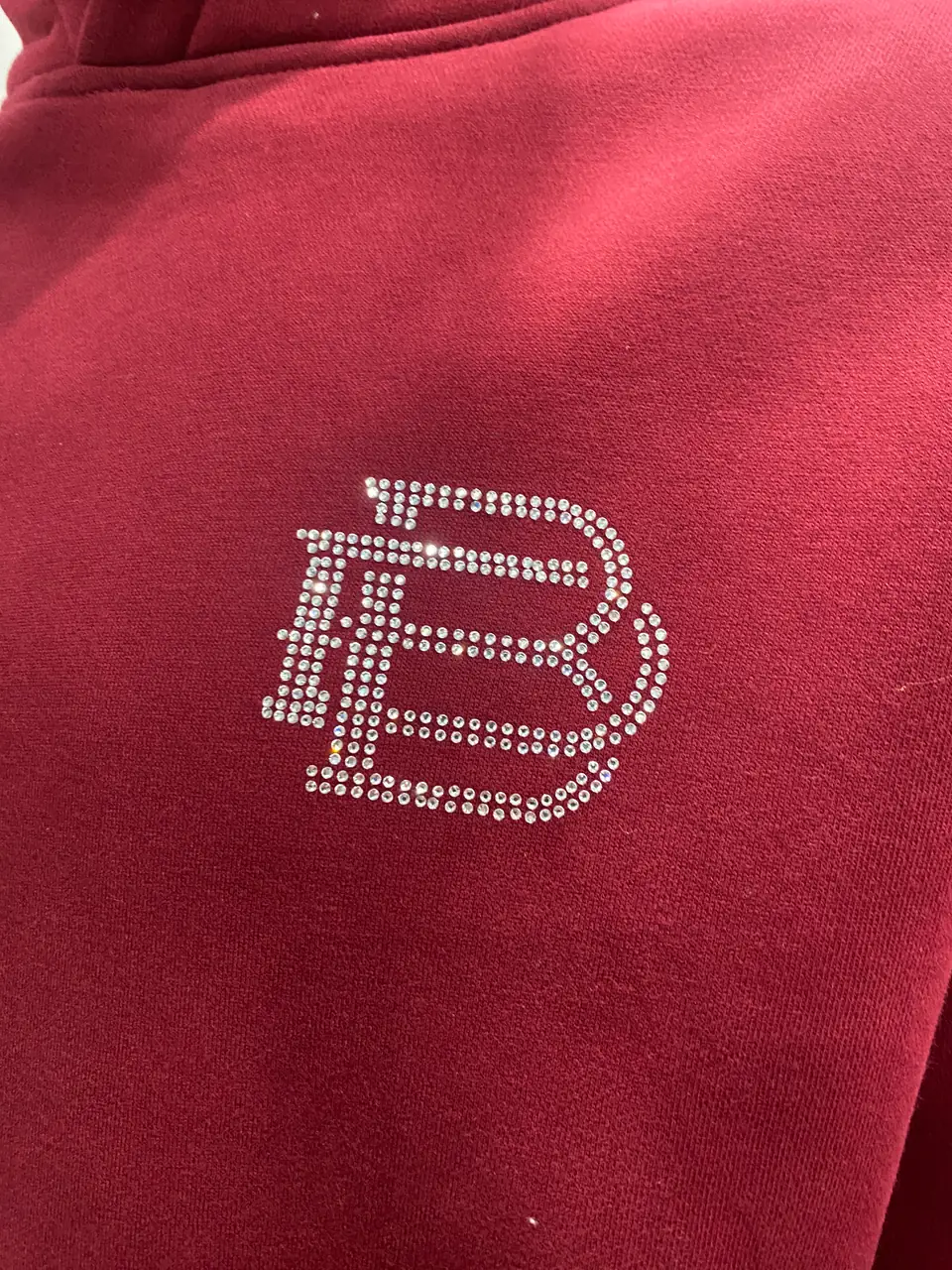 Rhinestone artwork placement prepared for garment application