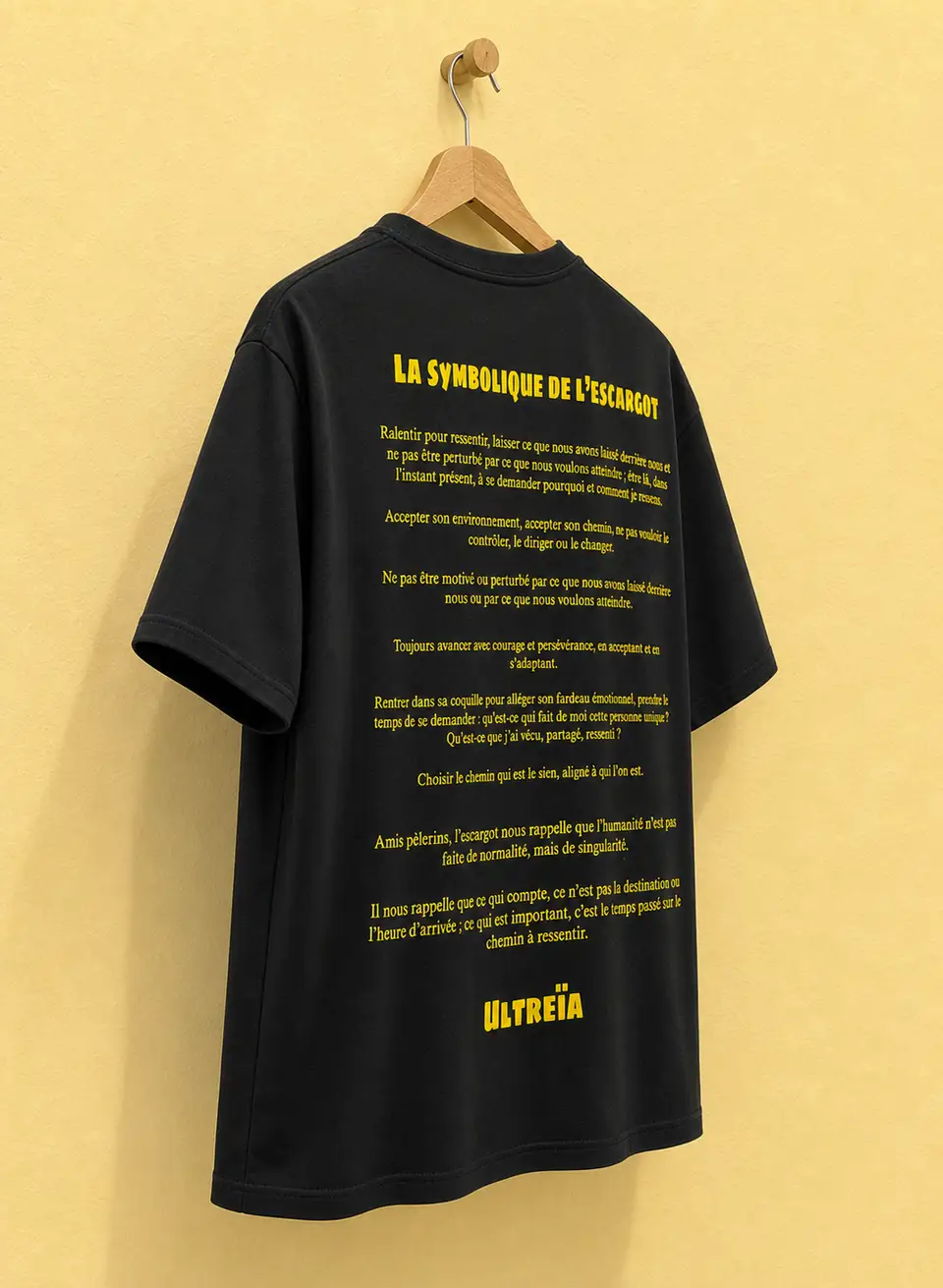 Finished screen printed T-shirt displayed on a wooden hanger
